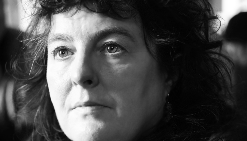 A headshot of poet Carol Ann Duffy who is a middle aged white woman with short hair