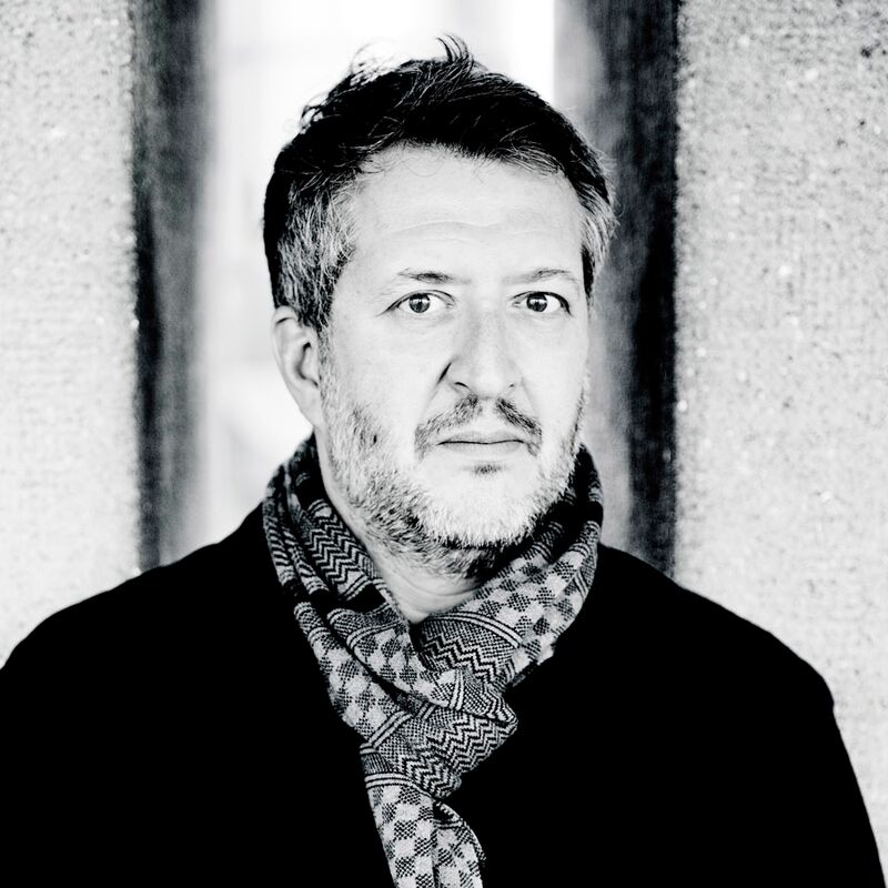 Composer Thomas Ades in a black jacket and scarf