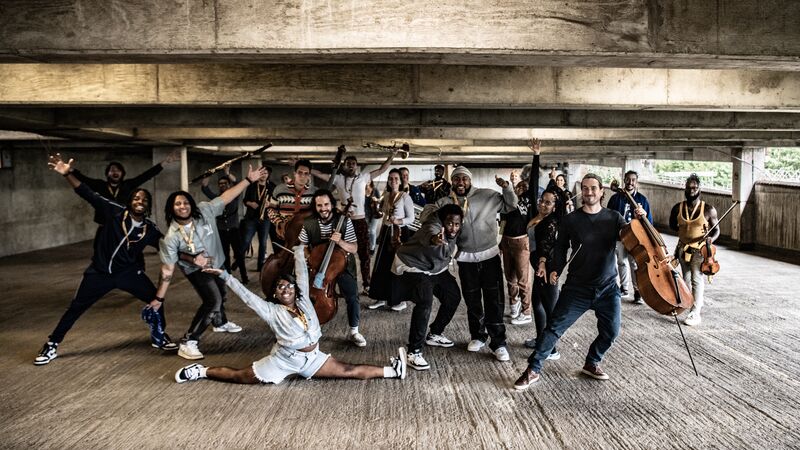 The Multi-Story Orchestra make some large poses