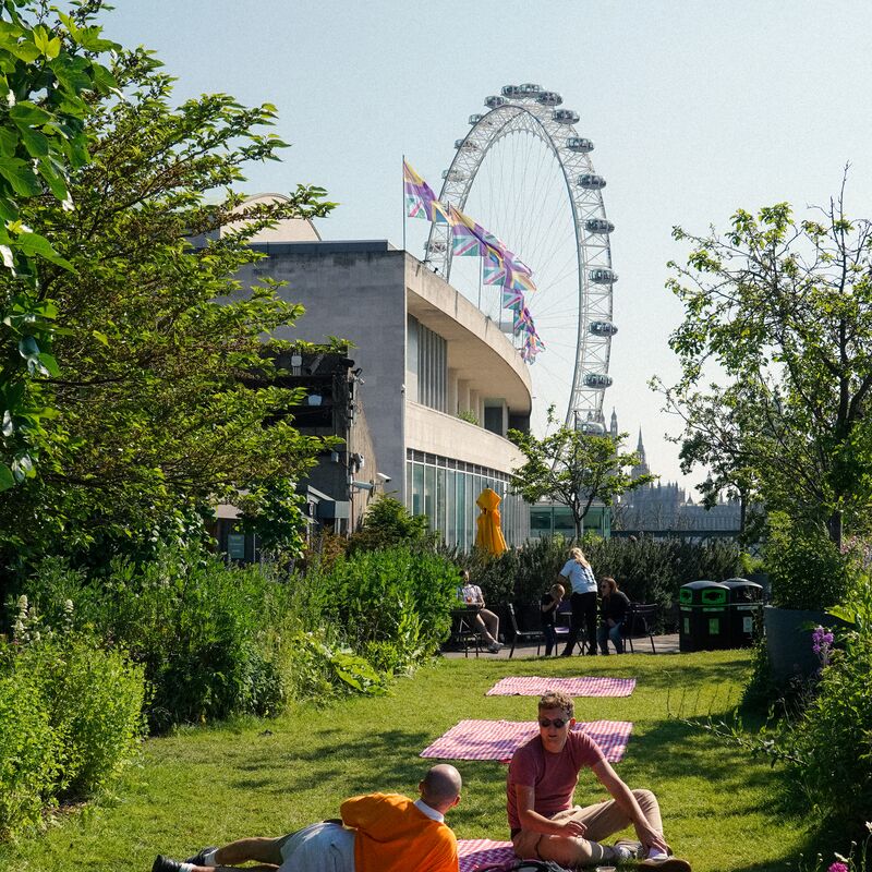 People on the roof garden terrace - the Royal Festival Hall and London Eye can be seen in the background