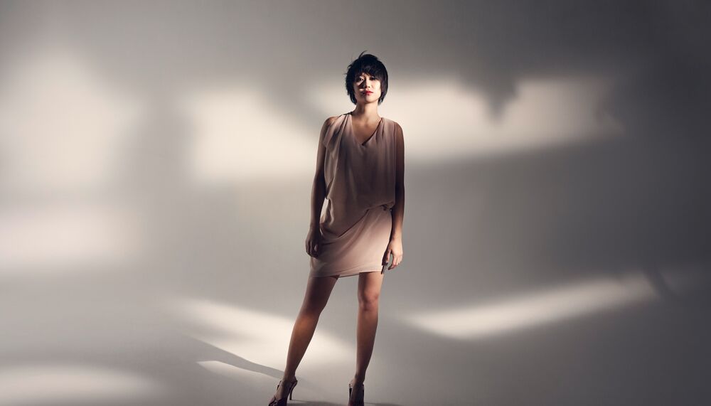 Yuja Wang in a beige flowing cocktail dress