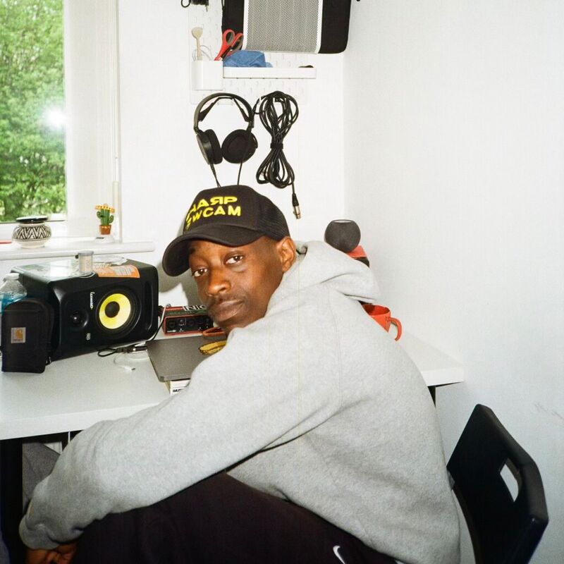 A man sitting at a desk looking straight at the camera