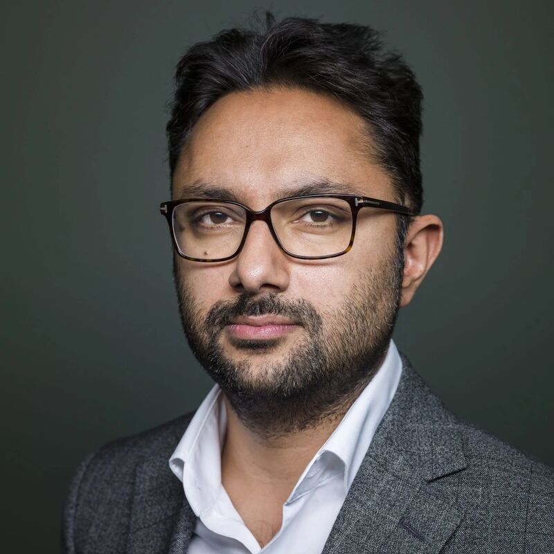 Author Sathnam Sanghera wears a grey jacket and white shirt