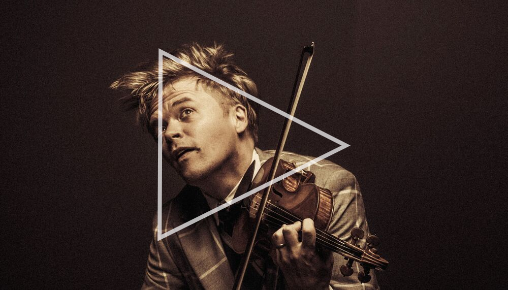 Pekka Kuusisto with a play button overlaid, to signify that if clicked through a video will open.