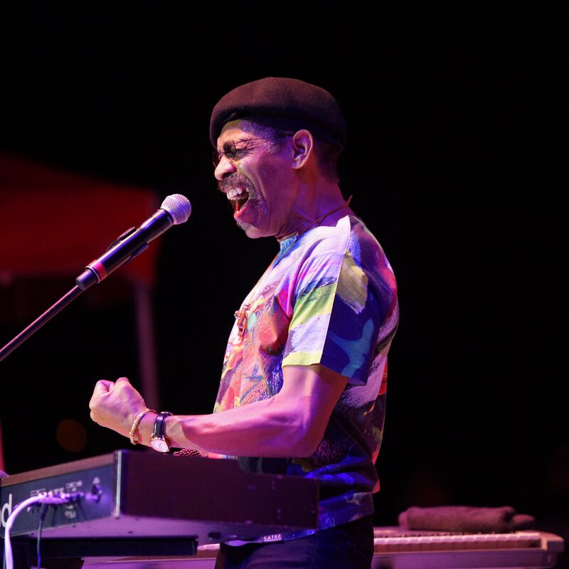 A member of WAR on stage, playing the keyboard