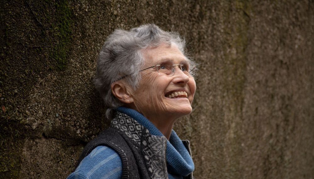 Annea Lockwood leaning on a wall