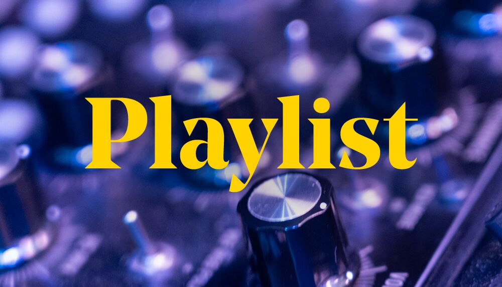 Close up of a sound board with 'Playlist' written over it in yellow