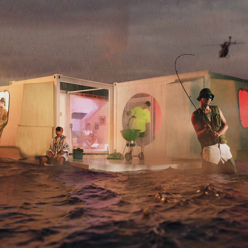 Band members of 15 15 posing in a portacabin that is floating in water