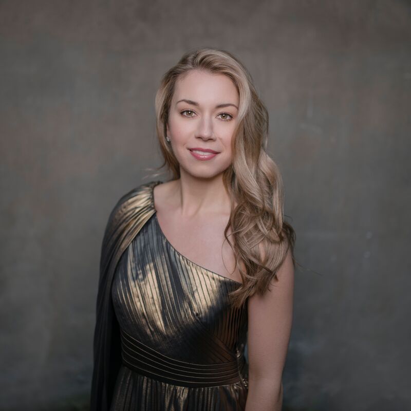 Soprano Olivia Boen, wearing a gold off the shoulder dress