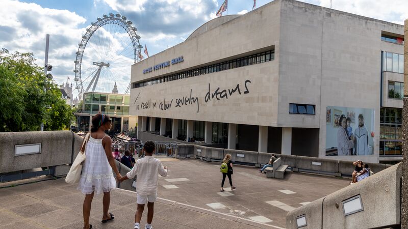 Image of the outer wall of the Royal Festival Hall displaying a line from a Lemn Sissay poem.