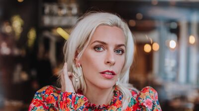 Sara Pascoe (left) with platinum hair and colourful top, Cariad Lloyd (right) with brown hair and grey jumper