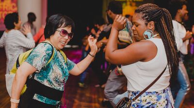Two people dancing in the Clore Ballroom