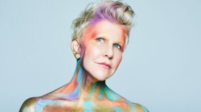 Mezzo-soprano Joyce DiDonato covered in multicoloured paint