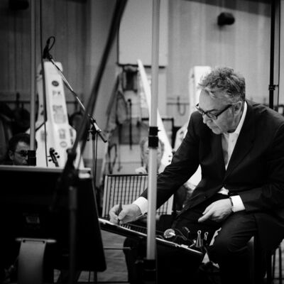 Black and white image of Howard Shore scoring in a studio