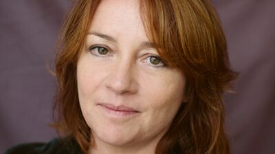 Eimear McBride wearing a silver necklace and a green top.