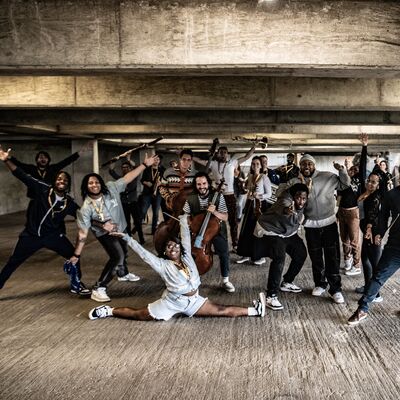 The Multi-Story Orchestra make some large poses