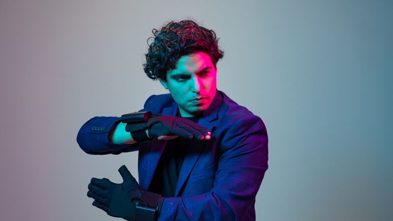 Zubin Kanga wearing haptic gloves