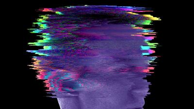 A side profile of a man's head, blurred with multicoloured static