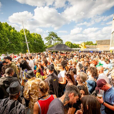 Crowd of people talking and dancing