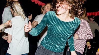 A group of people dancing in a club