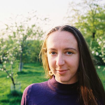 women in park looking into camera