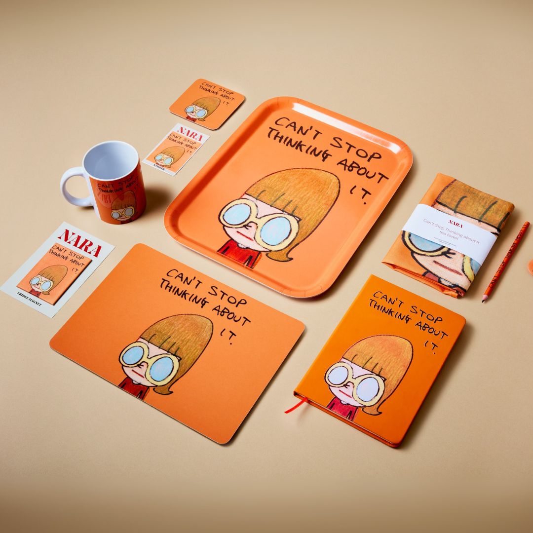 A flat lay of products featuring the Can't Stop Thinking about It artwork: a mug, magnet, tray, print, kitchen towel and notebook.