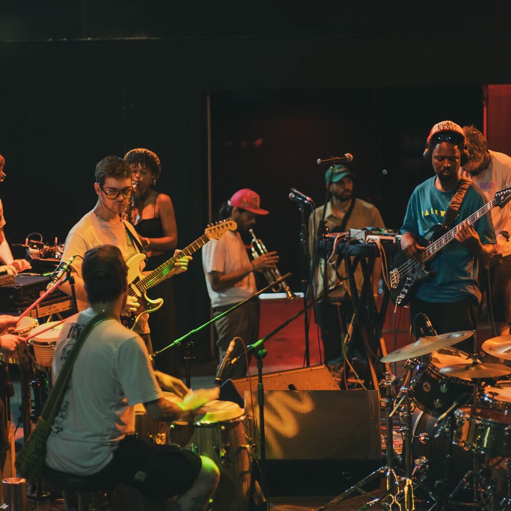 A group of musicians, playing a range of instruments.