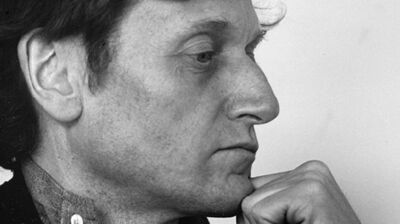 A side-profile portrait of French composer Gérard Grisey looking pensive
