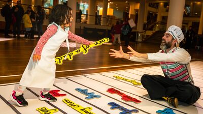 Girl playing with the Alphabet Soup installation at Southbank Centre.