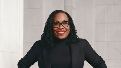 Justice Jackson in a black suit against a white background.