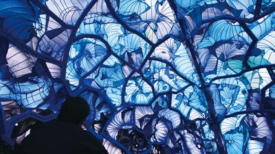 Installation artwork with blue fabric to create a dome with lots of patterns over wire shapes