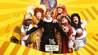 Group of actors dressed in outfits from different hostorical eras and cultures pulling different poses against a yellow backdrop