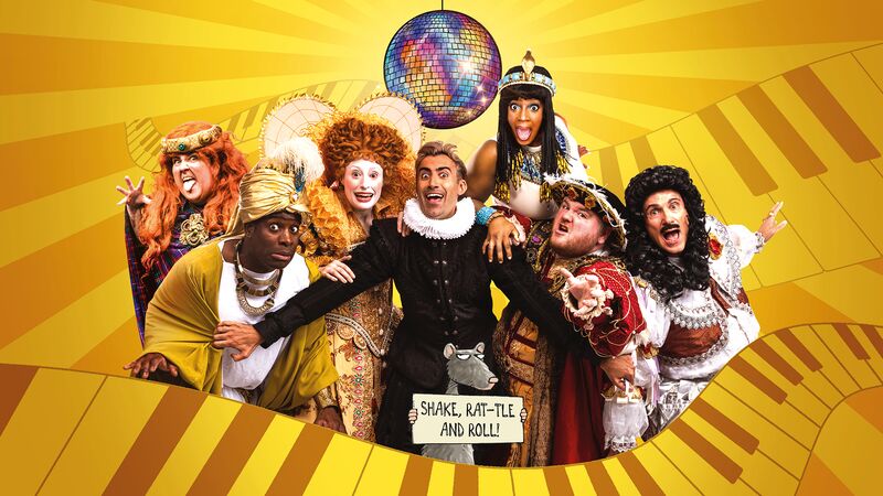 Group of actors dressed in outfits from different hostorical eras and cultures pulling different poses against a yellow backdrop