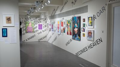 A brightly lit art gallery hallway featuring various colorful paintings and prints on the walls, overlaid with large, diagonally printed black text forming a poem or phrase.