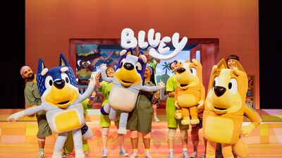 Large Bluey puppets on stage