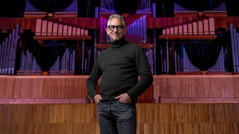 Gary Lineker, Co-Founder of Goalhanger, stands in front of the Royal Festival Hall organ.