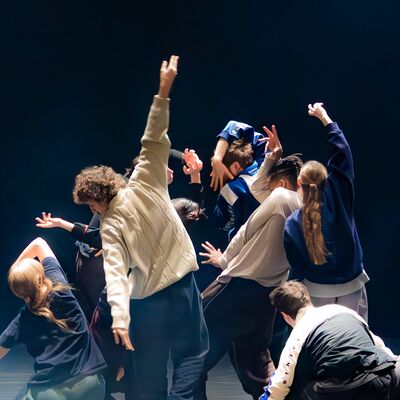Dancers perform on a stage