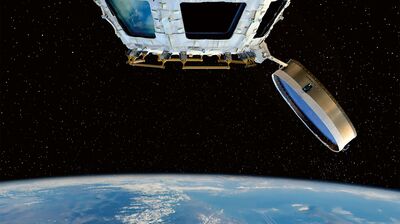 Earth seen from space, with the white window frames of an orbiting spacecraft module (Cupola) in the foreground.