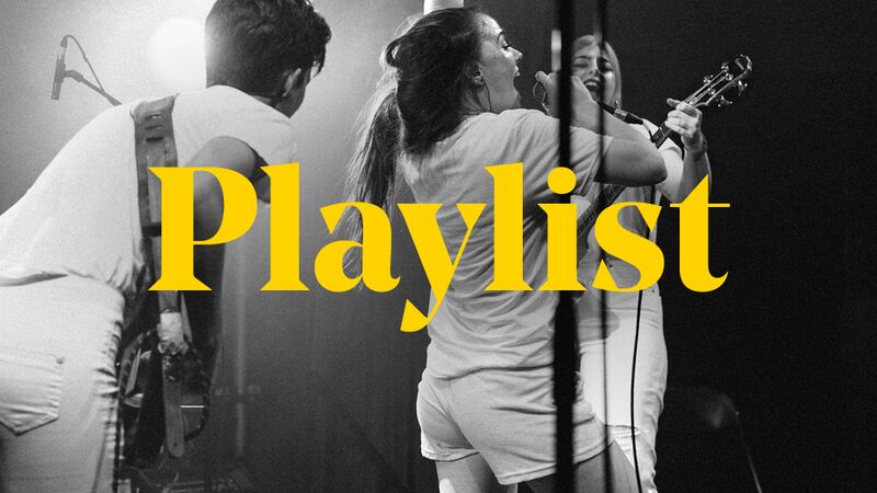Black and white picture of a band on stage. The word Playlist is overlaid on the image.
