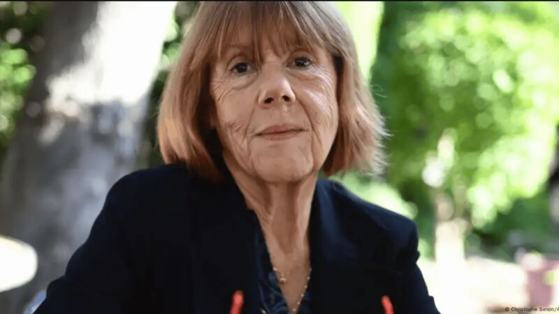 Gisele Pelicot wearing black and sitting in a garden.