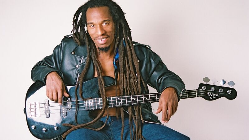 Benjamin Zephaniah sat with a guitar