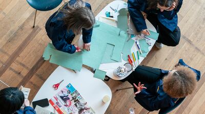 A birdseye view of children doing arts and crafts