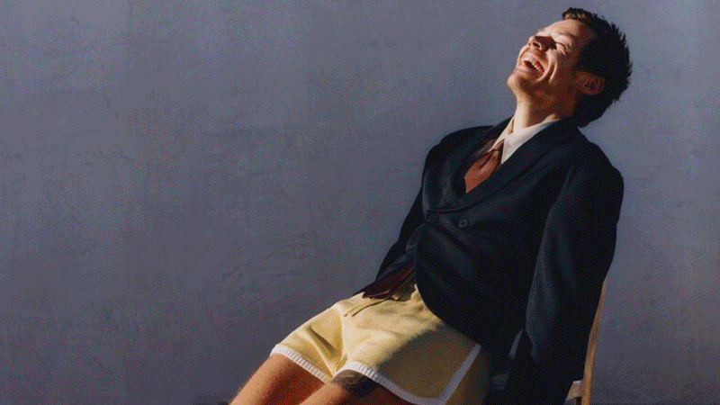 Dua Lipa in a reflective yellow top