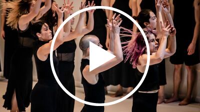 A close up of dancers dressed in black