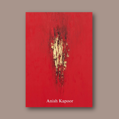 An overhead image of a red book, the catalogue for Anish Kapoor's exhibition at the Hayward Gallery,