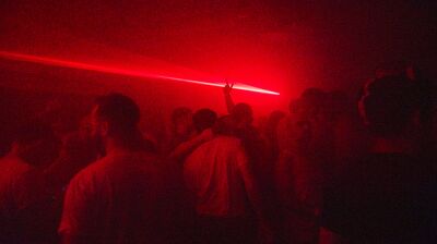 A club scene with red lighting
