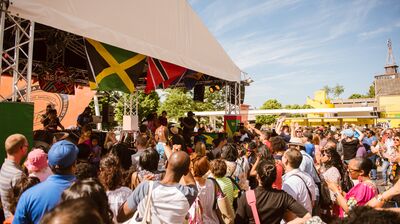 People dancing on Southbank Centre Riverside Terrace for Just Vibez Carnival as part of M.I.A.'s Meltdown festival