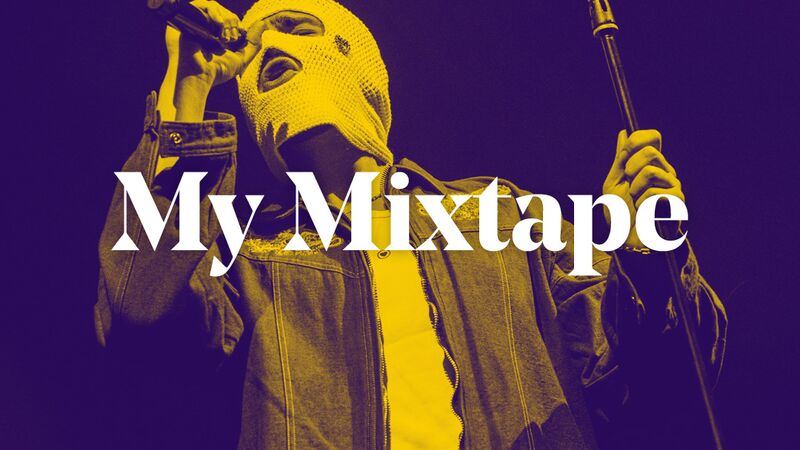 Musician Tul8te performs live at Fabrique in Milan, Italy. They are wearing a purple jacket with gold embroidery and a white balaclava as they sing into a hand-held microphone. The words ‘My Mixtape’ are placed over the top of the image.