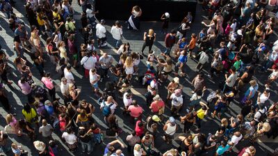A birdseye view of a crowd dancing on the Riverside Terrace