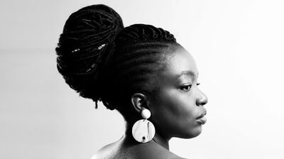 A black and white side profile of soprano Axelle Fanyo